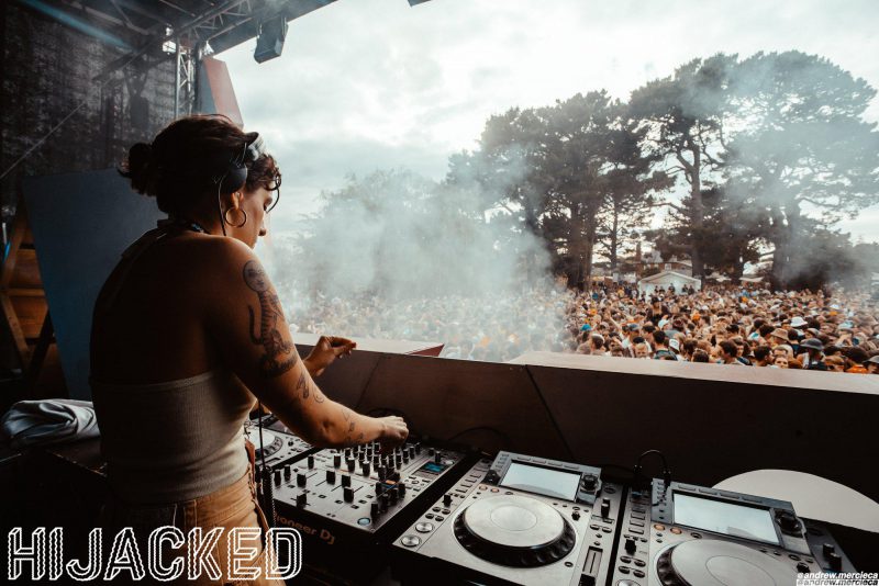 view of crowd and trees from dj booth