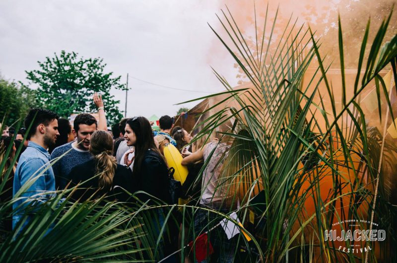crowd surrounded by plants