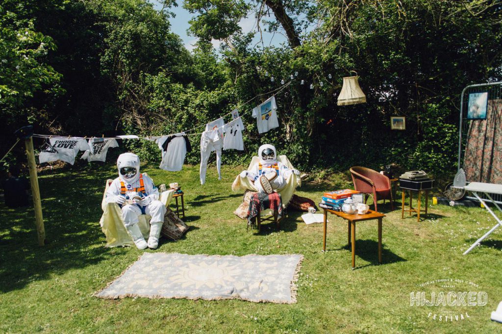 two astronauts in a garden